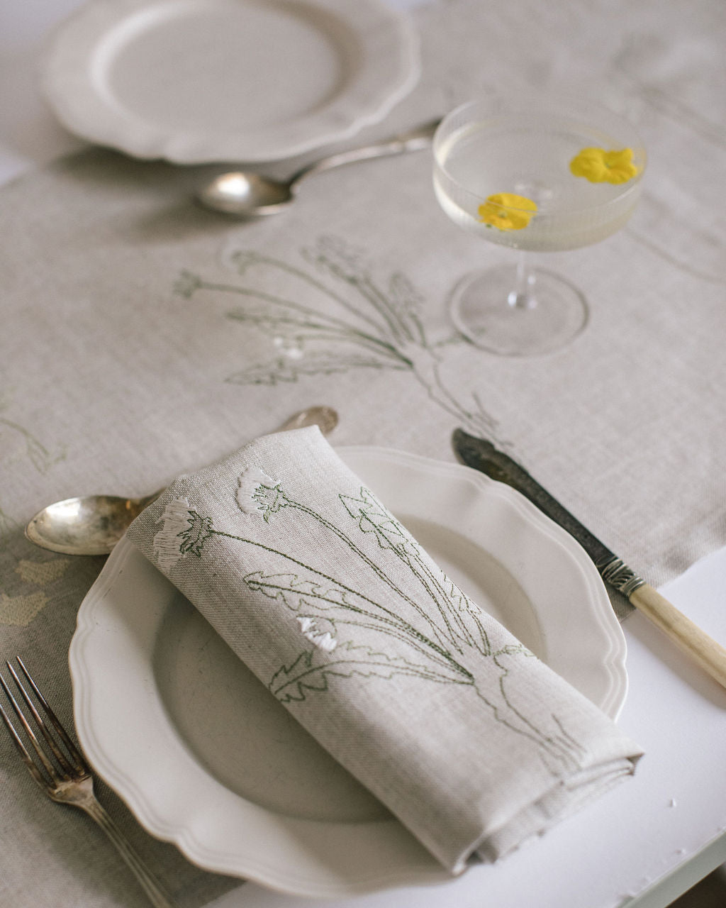 Irish linen napkin with detailed plant embroidery