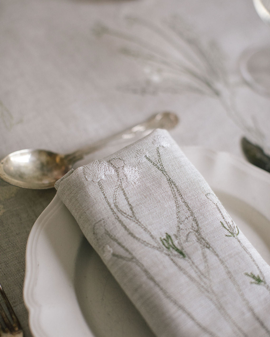 Embroidered plant on a natural Irish linen napkin