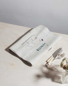 Irish linen table runner with wildflower embroidery in earthy colours