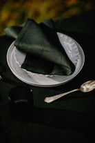 Plain irish linen napkin in a dark green