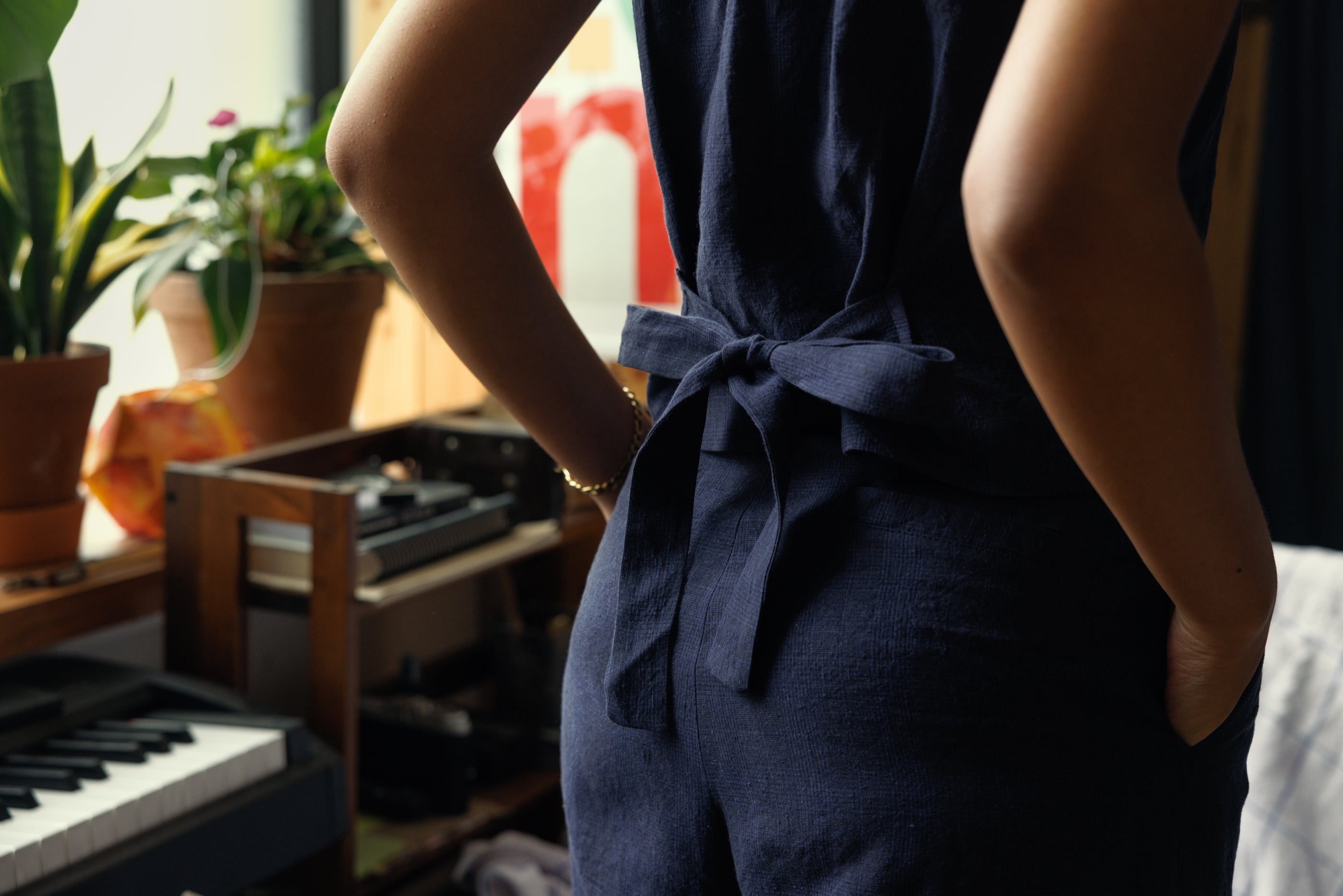 Waistcoat in subtle navy/black irish line with bow detail at the lower back