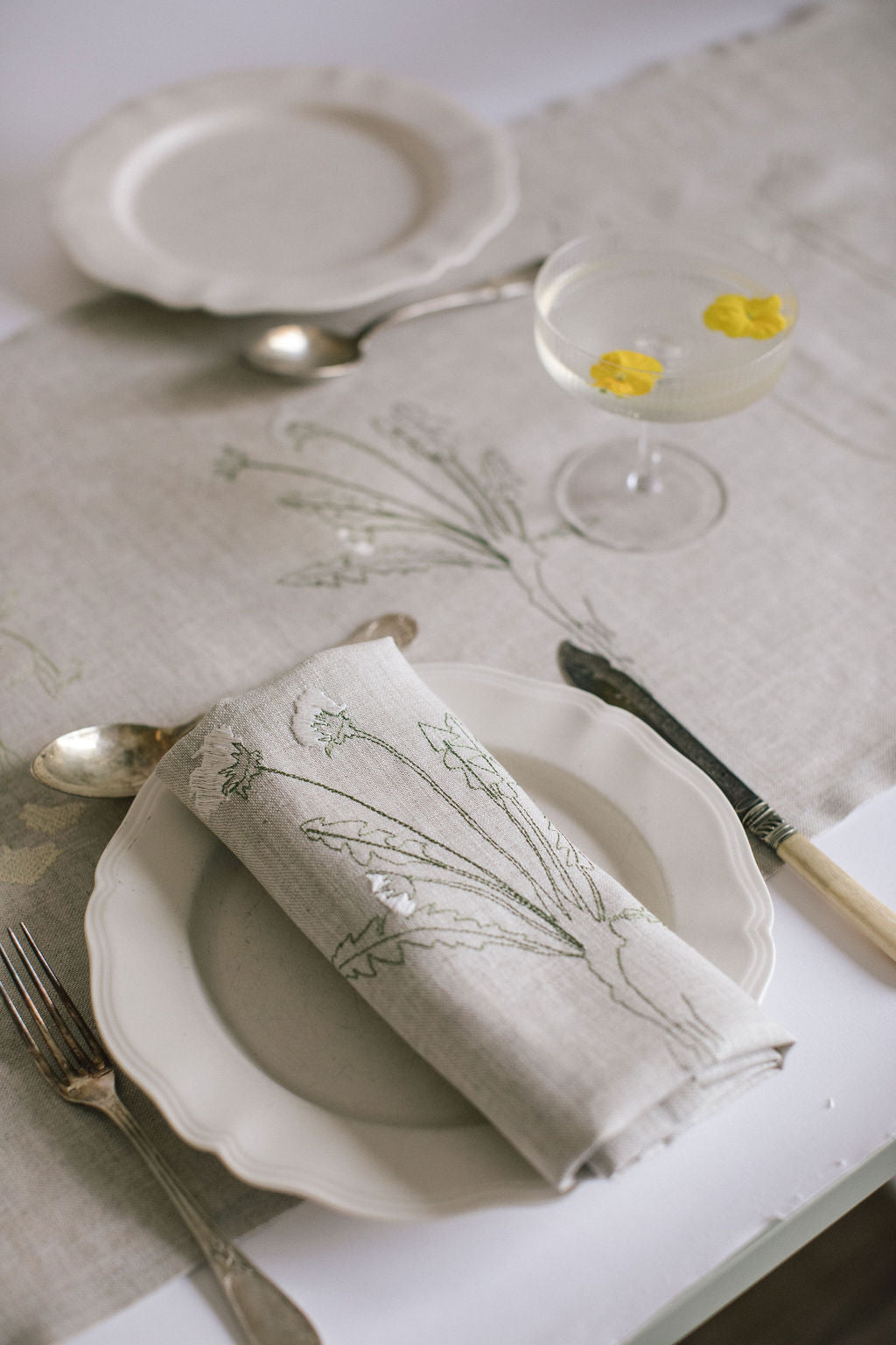 Irish linen napkin with detailed plant embroidery 