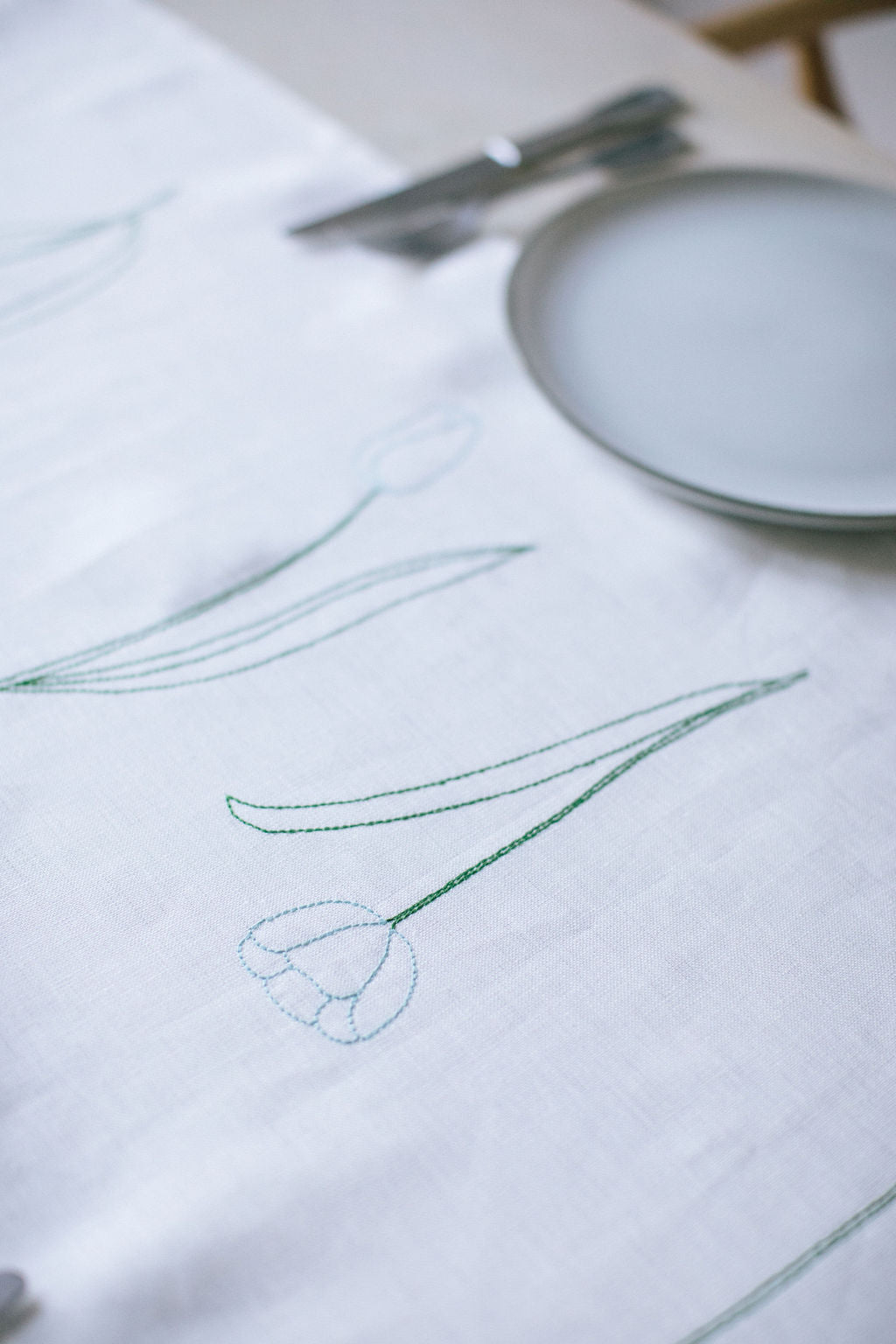 Ivory irish linen with tulip embroidery on the full length of the table runner 