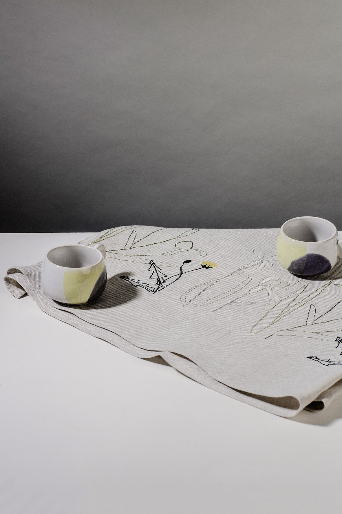 Irish linen table runner with embroidery of herbarium plants