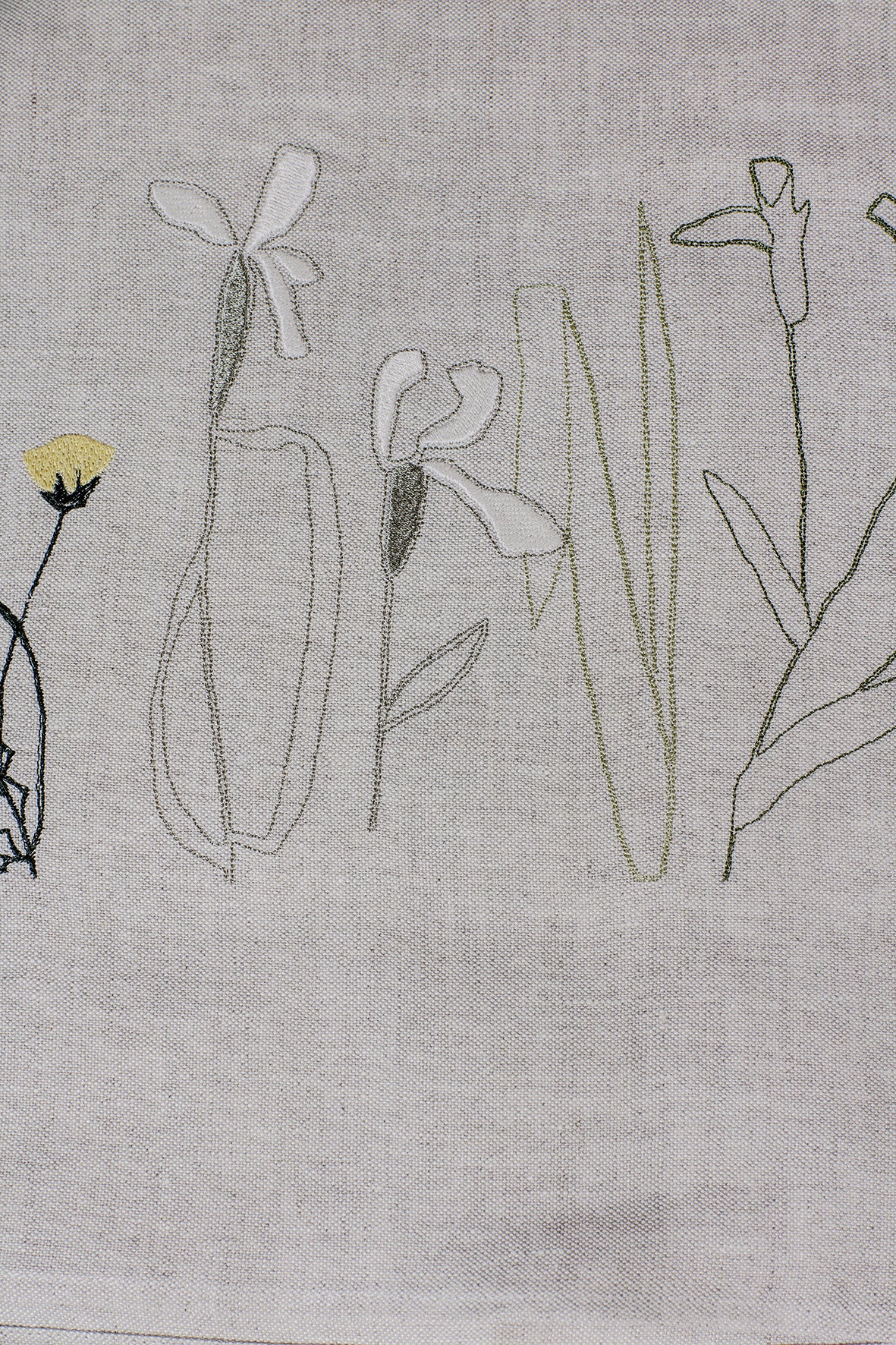 Irish linen tablerunner with plant embroidery in earthy green colours 