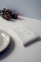 Metallic Irish wildflower embroidery on Irish linen napkin 