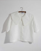White Irish linen top with oversized collar and pleat details 