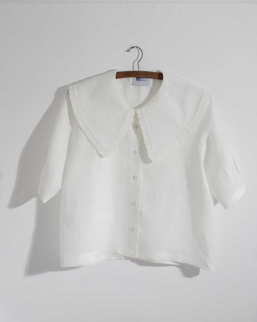 White Irish linen top with oversized collar and pleat details 