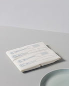 Irish linen napkin with powder blue knife and fork embroidery 