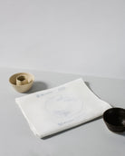 Irish linen tablerunner with powder blue embroidery of a knife, fork and plate 
