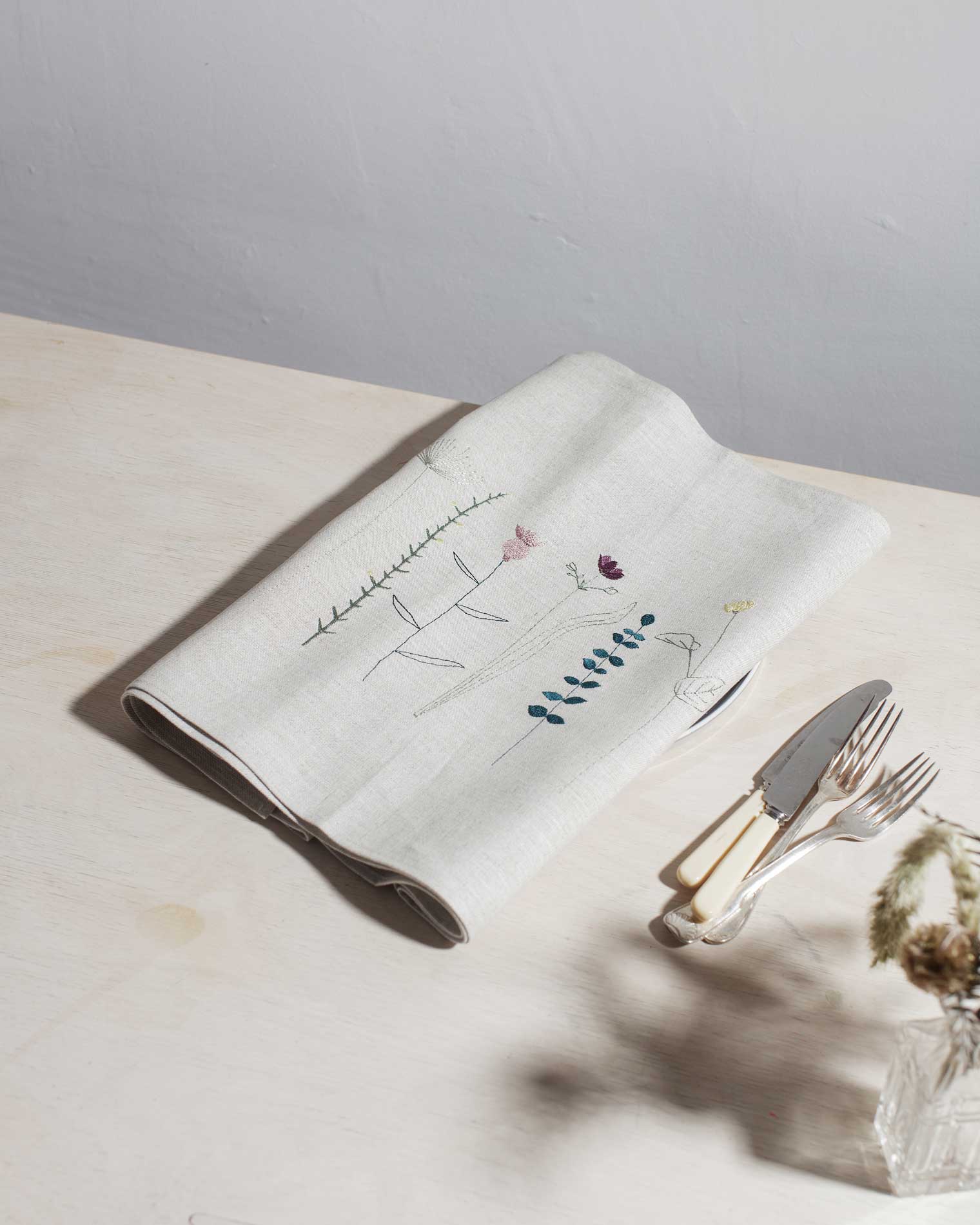 Irish linen table runner with wildflower embroidery in earthy colours 