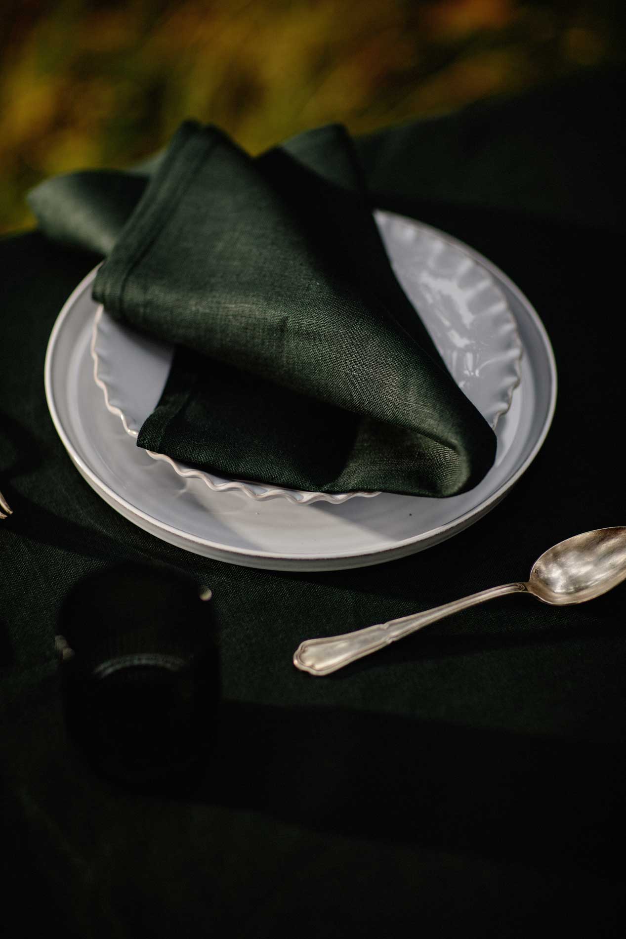 Plain irish linen napkin in a dark green 