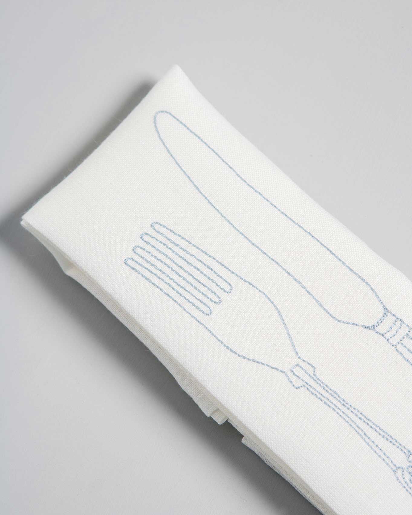 Powder blue cutlery embroidery on Irish linen napkin 