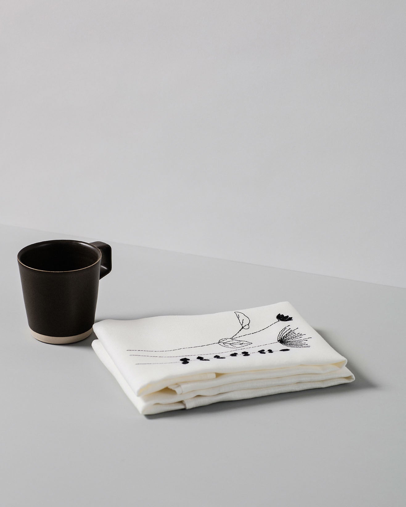 Irish linen napkin with black irish wildflower embroidery 