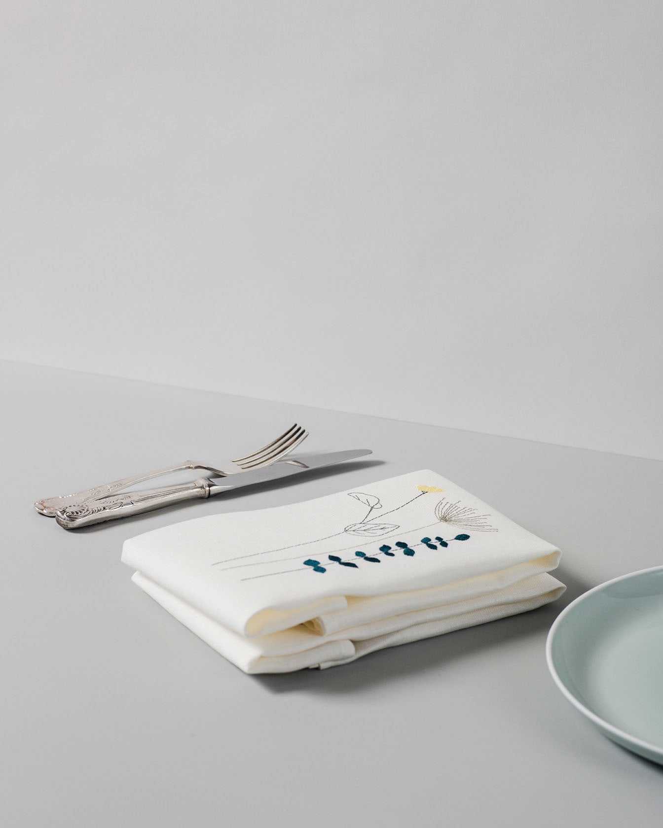Irish linen napkins in ivory with earth coloured irish wildflower embroidery  