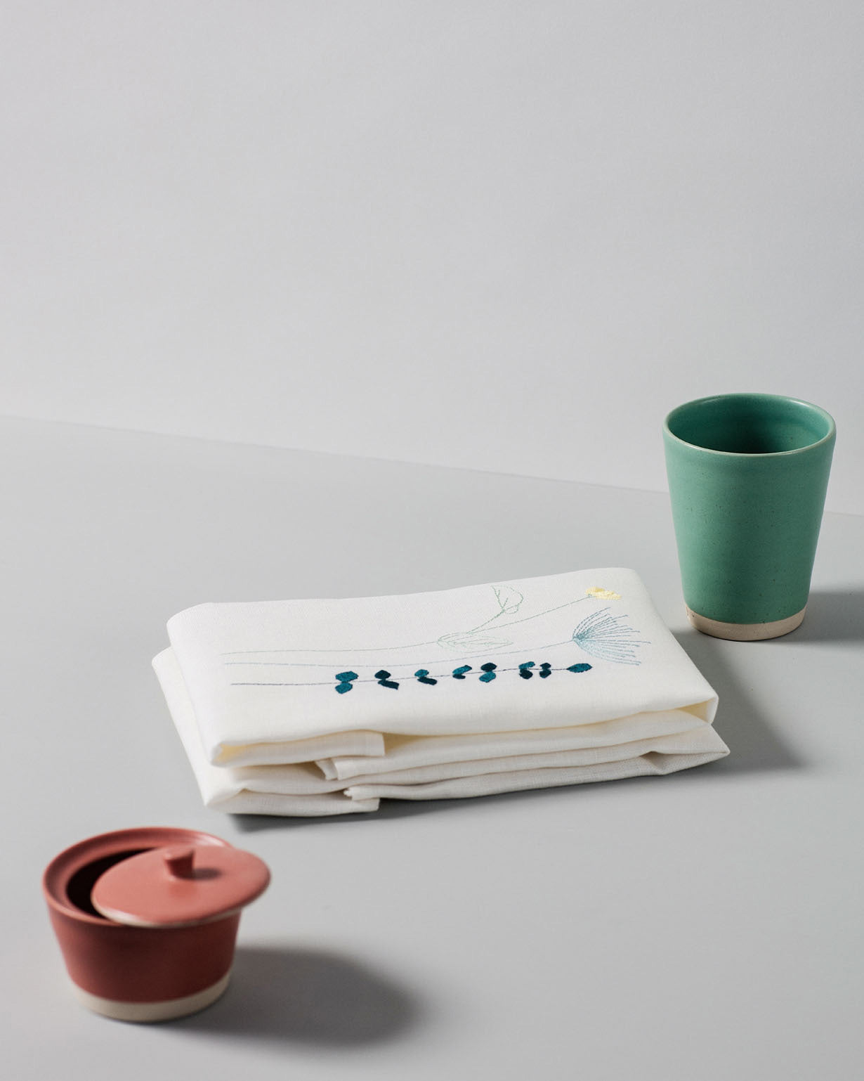 Irish linen napkin with irish wildflower embroidery in spring colours 