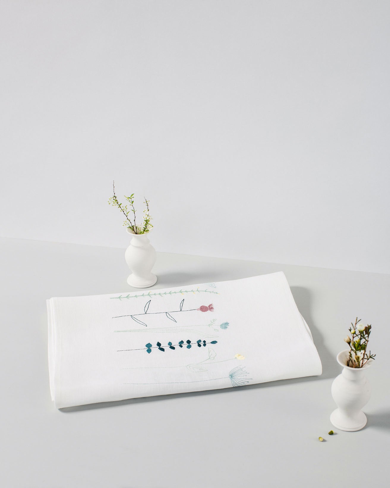 Irish linen tablerunner with wildflower embroidery in spring colours 