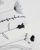 Irish linen table runner with black wildflower embroidery 